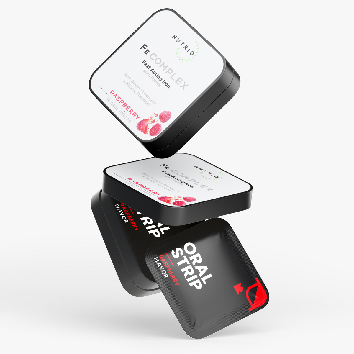 NUTRIO Fe Complex tins and a Raspberry oral strip pouch stacked in mid-air on a light background