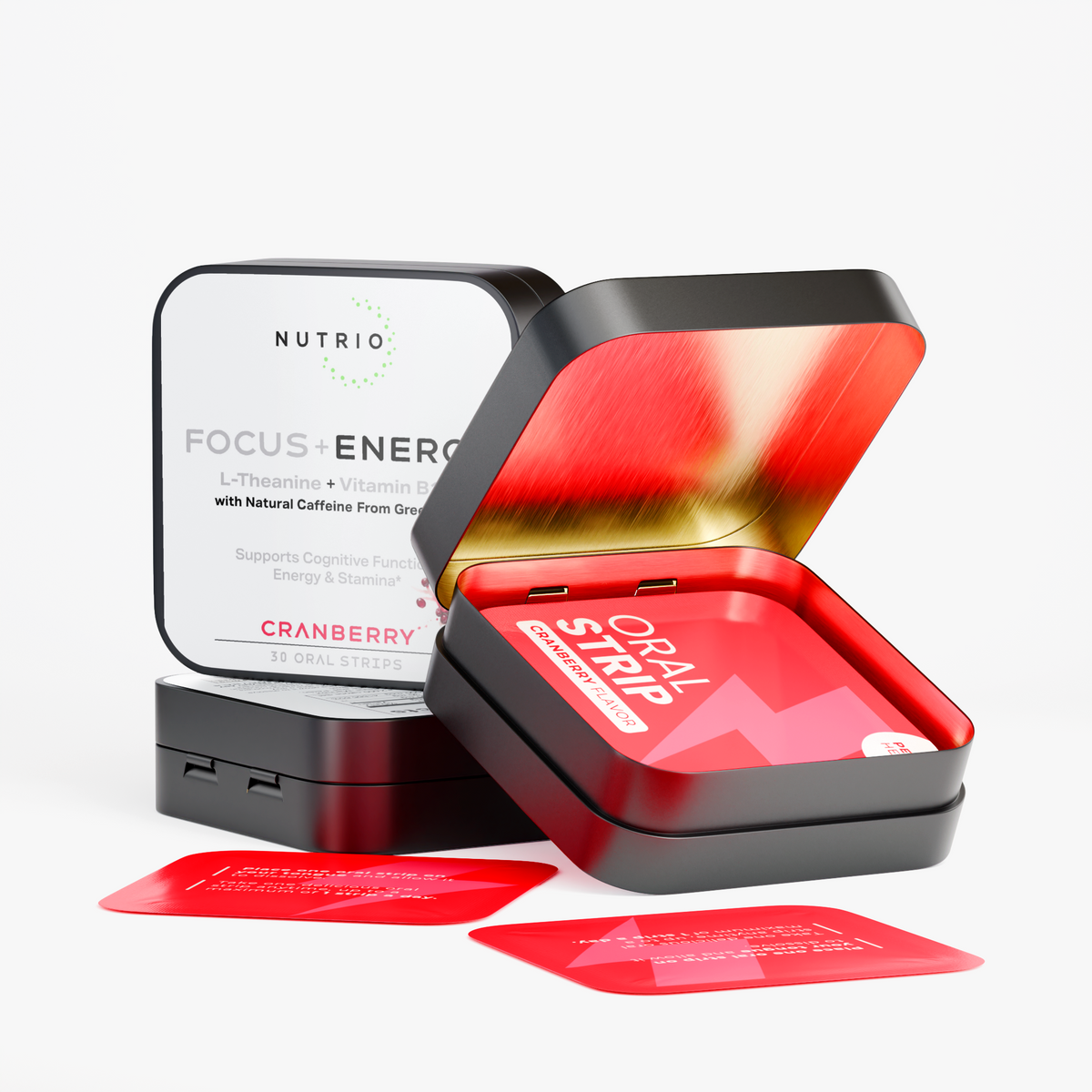 Open NUTRIO Focus + Energy tin with individually wrapped Cranberry oral strips, closed tin in the background