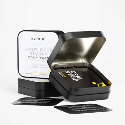 Open NUTRIO Hair, Skin & Nails tin with individually wrapped Orange oral strips, closed tin in the background