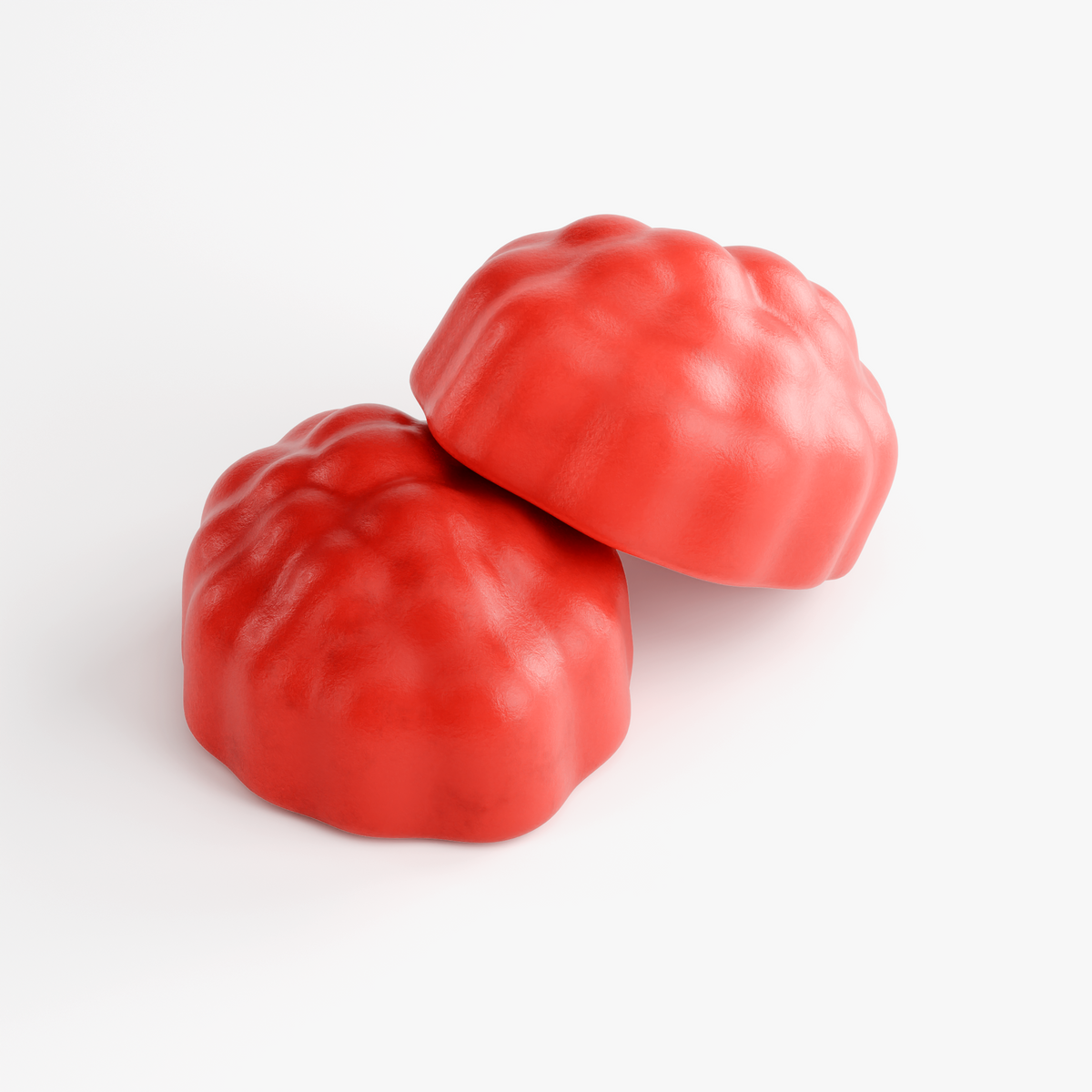 Close-up of two red NUTRIO Hair, Skin & Nails Passion Fruit multivitamin gummies
