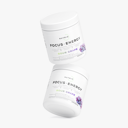 Two NUTRIO Focus + Energy Sour Grape powder tubs floating one above the other