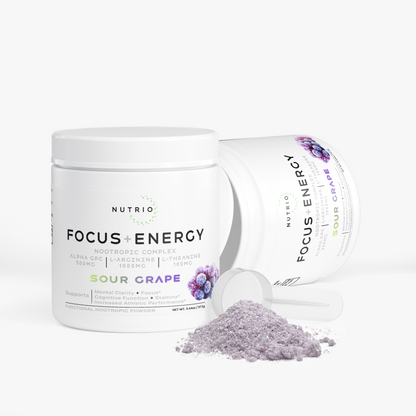 Two NUTRIO Focus + Energy Sour Grape tubs, one tipped on its side, with a scoop of purple powder