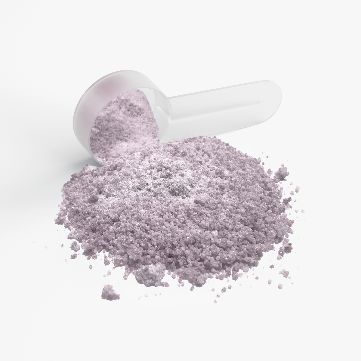 Close-up of NUTRIO Focus + Energy Sour Grape purple powder poured from a clear scoop