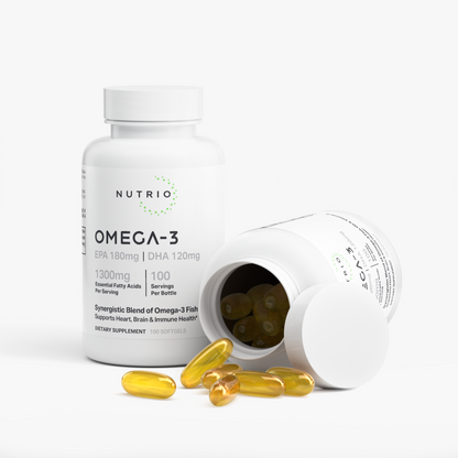 NUTRIO Omega-3 Fish Oil bottle beside an open bottle with golden softgels spilling onto the surface