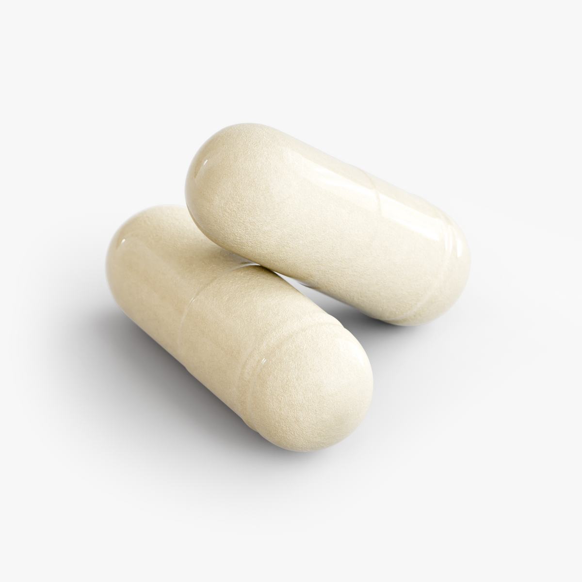Close-up of two cream-colored NUTRIO PRO-13 probiotic capsules on a white background
