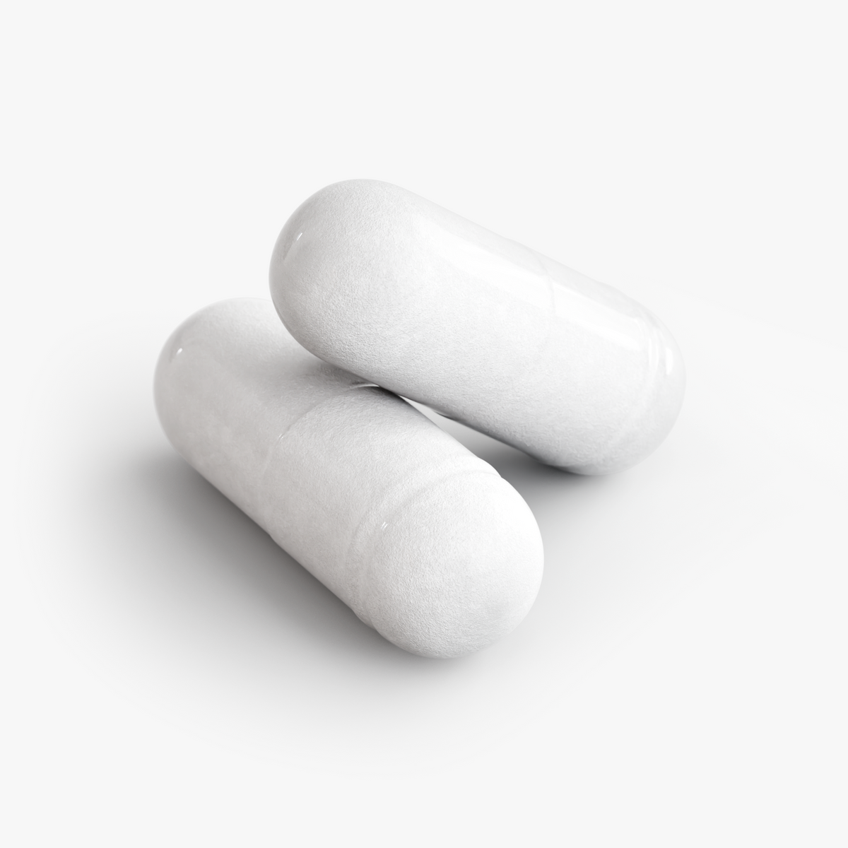 Close-up of two white NUTRIO Micro Balance probiotic capsules
