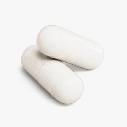 Close-up of two white NUTRIO Magnesium Glycinate capsules on a white background